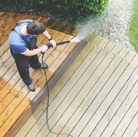 washing and cleaning a wooden patio floor